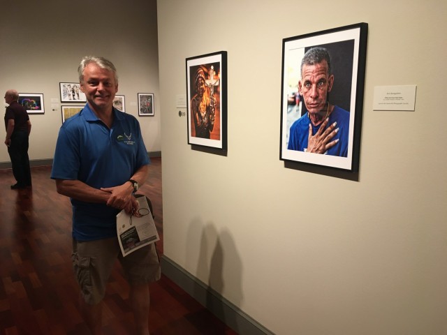 Rick Bumgardner, a public affairs specialist at the U.S. Army Security Assistance Command, visits a display of his photographs from Cuba at the Huntsville Museum of Art. 