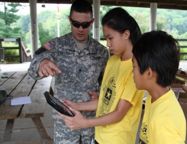 Students in 5th through 10th grade can hone their skills in science, technology, engineering and math (STEM) through a virtual summer camp program to be held this summer by C5ISR Center.  Pictured: Campers from the 2019 camp sessions learn about STEM from Army experts.