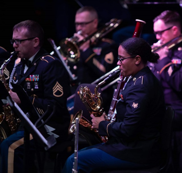 Spc. Allison Wollam plays the baritone saxophone during a 77th Army Band Christmas concert in 2019. A new instrument in her repertoire, Wollam said it was a fun challenge to learn the instrument in a couple months.