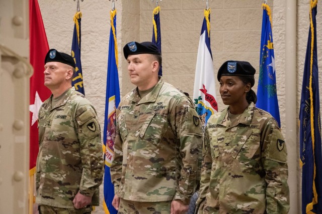 The official party of the Rock Island Arsenal – Joint Manufacturing and Technology Center change of command stands at attention at the start of the ceremony July 15 at Rock Island Arsenal, Ill. The official party consisted of (left to right) Maj. Gen. Darren L. Warner, Tank-automotive and Armaments Command commanding general; Col. Martin J. Hendrix III, 50th commanders of RIA-JMTC and Col. Shari Bennett, 51st commander of RIA-JMTC. (U.S. Army photo by Debralee Best/RIA-JMTC)