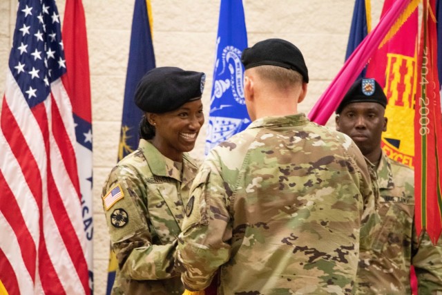 Col. Shari Bennett accepts the Rock Island Arsenal – Joint Manufacturing and Technology Center colors signifying her acceptance of command during the change of command ceremony, July 15 at Rock Island Arsenal, Ill. Bennett serves as the 51st...