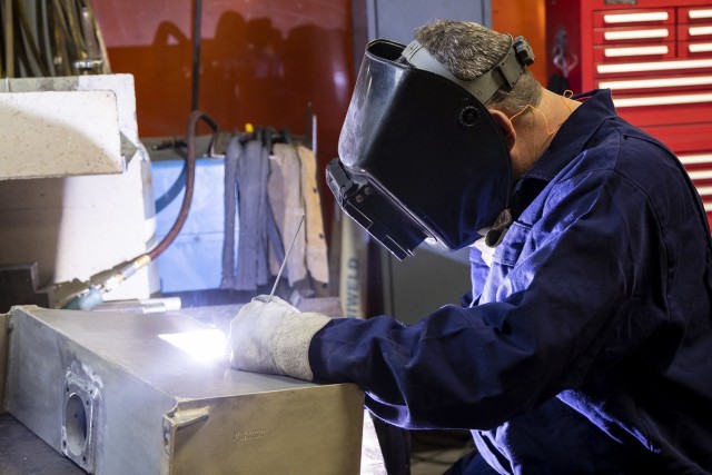 Using the Gas Tungsten Arc Welding (TIG) process, Eddie Stewart repairs a crack in the M113 fluid section tank. (U.S. Army Photo by Mark Cleghorn)