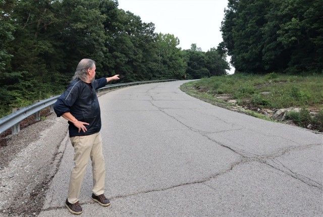 Goatley points to the top of the hill as he nears the summit during his third attempt.
