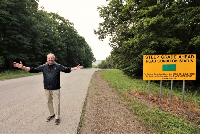 Goatley celebrates after successfully making it to the top of Misery Hill — 56 years after he first climbed it during basic training.