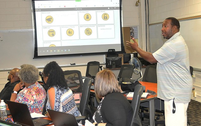 Fitzgerald Ward, a contract instructor-manager with CACI, discusses the Integrated Personnel and Pay System-Army with training conference attendees July 13 at the Army Logistics University. Fort Lee hosted IPPS-A training for human resource and...