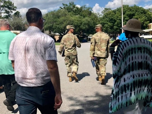 Fort Stewart-Hunter Army Airfield garrison commander, Col. Manny Ramirez and 3rd Infantry Division senior enlisted leader, Command Sgt. Maj. Quentin Fenderson, lead the way during a Walking Town Hall throughout the North and South Bryan Village...
