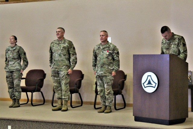 Garrison leaders stand at attention after Command Sgt. Maj. Paul Mantha, former Fort McCoy Garrison command sergeant major, received the Legion of Merit in a special awards presentation ceremony July 1, 2021, at Fort McCoy, Wis. Garrison Commander...