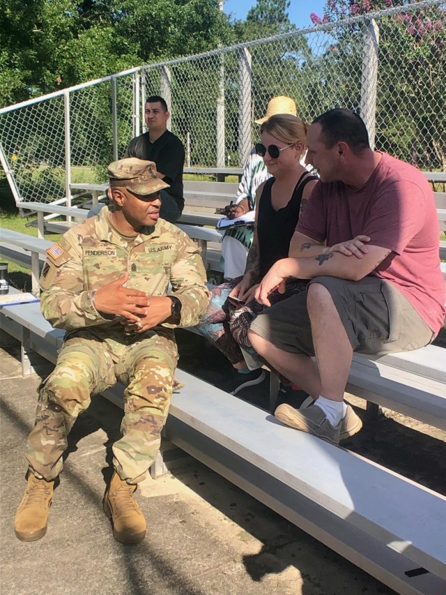3rd Infantry Division senior enlisted leader, Command Sgt. Maj. Quentin Fenderson speaks with South Bryan Village housing residents Sgt. 1st Class Patrick Hayday and Rebekah Pillow during a face-to-face housing town hall hosted for North and South...