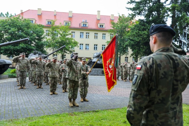 The 53rd Movement Control Battalion Command Sgt. Maj. LaVaughn Brown stands before his Soldiers as they salute during the transfer of authority ceremony in Żagań, Poland, July 14, 2021. The 53rd finished up a nine-month rotation to Poland in...