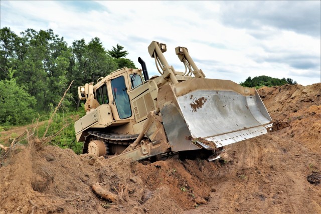 Soldiers with the Wisconsin National Guard's 950th Engineering Company (Route Clearance) work on a troop project at a training area July 12, 2021, at Fort McCoy, Wis. The work is part of a troop project coordinated by the Fort McCoy Directorate of...