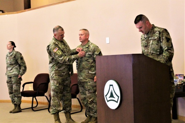 Command Sgt. Maj. Paul Mantha, former Fort McCoy Garrison command sergeant major, receives the Legion of Merit in a special awards presentation ceremony July 1, 2021, at Fort McCoy, Wis. Garrison Commander Col. Michael Poss presented Mantha with...