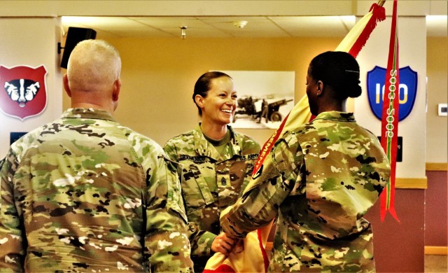 Command Sgt. Maj. Raquel DiDomenico, new Fort McCoy Garrison command sergeant major, passes the garrison flag back to 1st Sgt. Lauren Phillips, garrison first sergeant, July 1, 2021, during a change of responsibility ceremony at Fort McCoy, Wis....