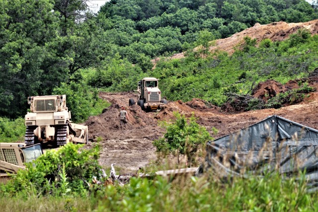 Soldiers with the Wisconsin National Guard's 950th Engineering Company (Route Clearance) work on a troop project at a training area July 12, 2021, at Fort McCoy, Wis. The work is part of a troop project coordinated by the Fort McCoy Directorate of...