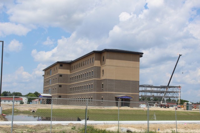 Construction of a new multi-million dollar transient troop training barracks is shown July 1, 2021, at Fort McCoy, Wis. Contractor L.S. Black Constructors was awarded a $20.6 million contract to build the barracks in September 2019. The planned completion date is currently August 2021. The planned barracks will be different than the traditional barracks that are located throughout the installation. This new building is four stories and be able to house 400 people in approximately 60,000 square feet. The project also is the first of eight new buildings planned for the entire 1600 block at Fort McCoy. The plan is to build three more barracks with the same specifications, three 20,000-square-foot brigade headquarters buildings, and one 160-room officer quarters. This is an Army Corps of Engineers-managed project. (U.S. Army Photo by Scott T. Sturkol, Public Affairs Office, Fort McCoy, Wis.)