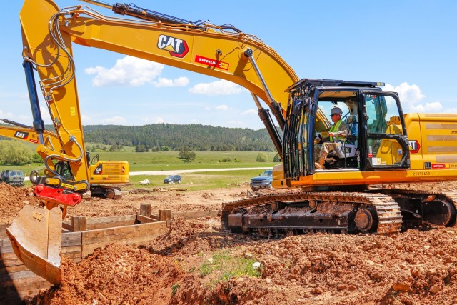 Chief Warrant Officer 2 Raymond Cowden, a construction engineering technician with the Joint Multinational Readiness Center’s Troop Construction Program, backfills some dirt along a 100-meter trench at the Hohenfels Training Area, Hohenfels,...