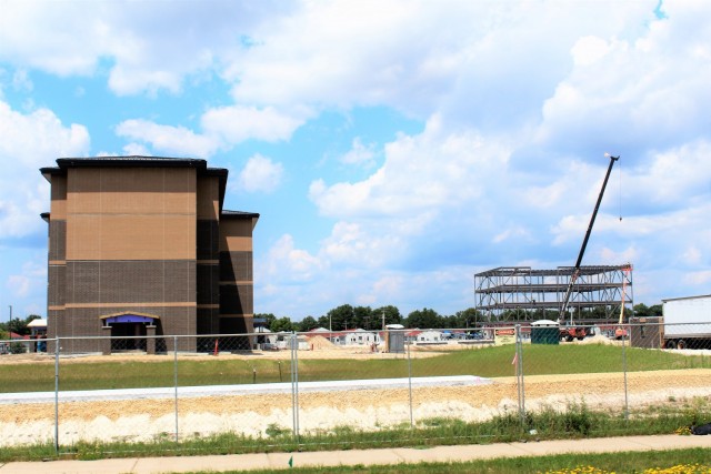 Construction of a new multi-million dollar transient troop training barracks is shown July 1, 2021, at Fort McCoy, Wis. Contractor L.S. Black Constructors was awarded a $20.6 million contract to build the barracks in September 2019. The planned completion date is currently August 2021. The planned barracks will be different than the traditional barracks that are located throughout the installation. This new building is four stories and be able to house 400 people in approximately 60,000 square feet. The project also is the first of eight new buildings planned for the entire 1600 block at Fort McCoy. The plan is to build three more barracks with the same specifications, three 20,000-square-foot brigade headquarters buildings, and one 160-room officer quarters. This is an Army Corps of Engineers-managed project. (U.S. Army Photo by Scott T. Sturkol, Public Affairs Office, Fort McCoy, Wis.)