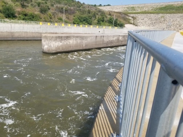 A view of the Tuttle Creek stilling basin in Manhattan, Kan., from the top of the dam showing the water flow. July 19, 2021. Rehabilitation of the stilling basin will soon be complete.