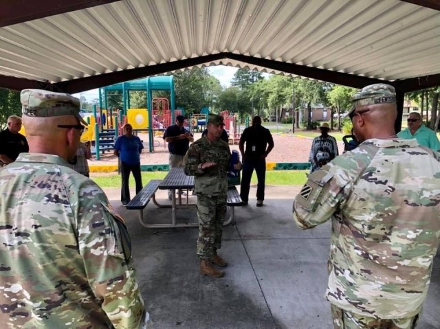 Garrison senior enlisted leader, Command Sgt. Maj. Bryan Buchanan briefs Installation leadership, Garrison representatives and Balfour Beatty Communities housing team prior to the North and South Bryan Village housing area walking town hall, July...