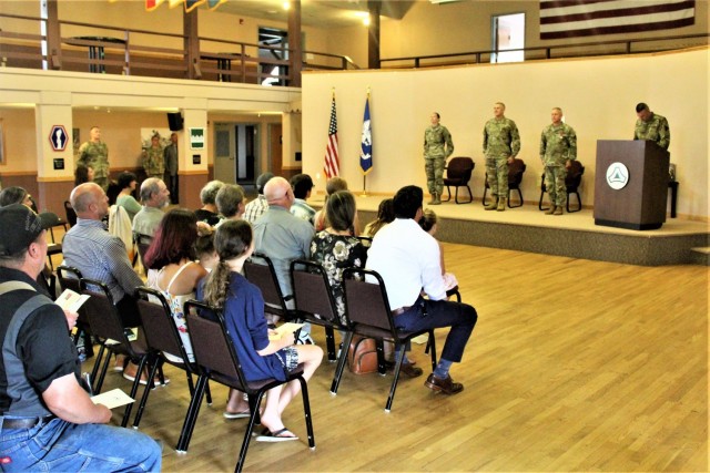Garrison leaders stand at attention after Command Sgt. Maj. Paul Mantha, former Fort McCoy Garrison command sergeant major, received the Legion of Merit in a special awards presentation ceremony July 1, 2021, at Fort McCoy, Wis. Garrison Commander...