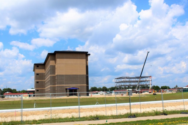 Construction of a new multi-million dollar transient troop training barracks is shown July 1, 2021, at Fort McCoy, Wis. Contractor L.S. Black Constructors was awarded a $20.6 million contract to build the barracks in September 2019. The planned completion date is currently August 2021. The planned barracks will be different than the traditional barracks that are located throughout the installation. This new building is four stories and be able to house 400 people in approximately 60,000 square feet. The project also is the first of eight new buildings planned for the entire 1600 block at Fort McCoy. The plan is to build three more barracks with the same specifications, three 20,000-square-foot brigade headquarters buildings, and one 160-room officer quarters. This is an Army Corps of Engineers-managed project. (U.S. Army Photo by Scott T. Sturkol, Public Affairs Office, Fort McCoy, Wis.)