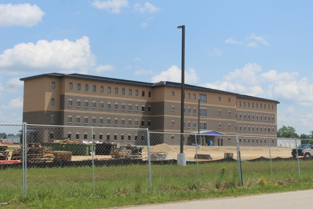 Construction of a new multi-million dollar transient troop training barracks is shown July 1, 2021, at Fort McCoy, Wis. Contractor L.S. Black Constructors was awarded a $20.6 million contract to build the barracks in September 2019. The planned completion date is currently August 2021. The planned barracks will be different than the traditional barracks that are located throughout the installation. This new building is four stories and be able to house 400 people in approximately 60,000 square feet. The project also is the first of eight new buildings planned for the entire 1600 block at Fort McCoy. The plan is to build three more barracks with the same specifications, three 20,000-square-foot brigade headquarters buildings, and one 160-room officer quarters. This is an Army Corps of Engineers-managed project. (U.S. Army Photo by Scott T. Sturkol, Public Affairs Office, Fort McCoy, Wis.)