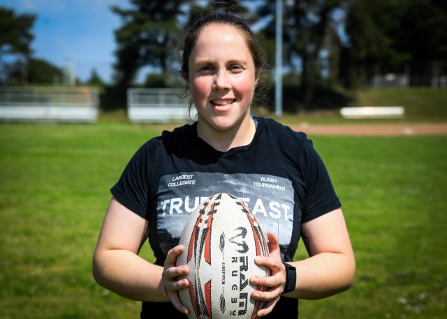 LANDSTUHL, Germany - U.S. Army Sgt. MaryCatherine Innace, nutrition care specialist, Nutrition Care Division, Landstuhl Regional Medical Center, holds a rugby ball prior to warming at LRMC, June10. Innace was recently selected as a team member for the All-Army Women’s Rugby Team which went undefeated against teams from the Navy, Marine Corps, Air Force (with Space Force personnel) and Coast Guard during the second-ever Armed Forces Women’s Rugby Championship.