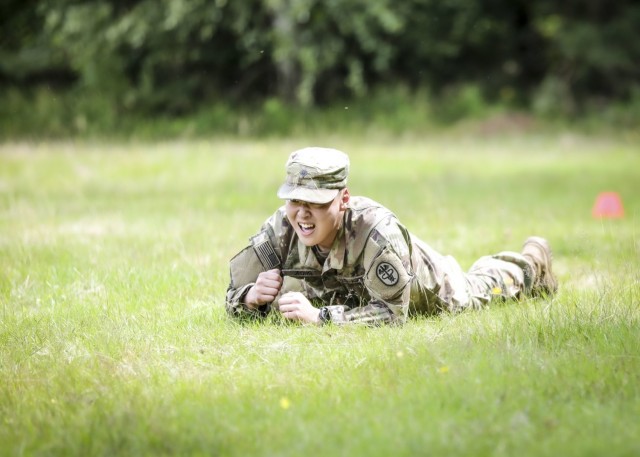 LANDSTUHL, Germany - U.S. Army Spc. Seongjong Jeong, healthcare specialist, U.S. Army Health Clinic Vicenza, performs a low crawl during the medical evacuation event of Landstuhl Regional Medical Center’s Best Warrior Competition, July 7. The...