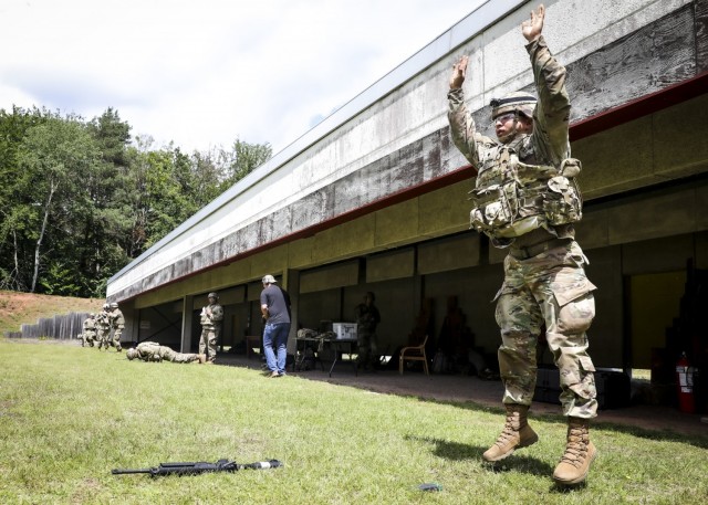 LANDSTUHL, Germany – U.S. Army Spc. Phillip Xu, pharmacy technician, Landstuhl Regional Medical Center, performs a burpee with full combat gear during the stress shoot portion of Landstuhl Regional Medical Center’s Best Warrior Competition,...