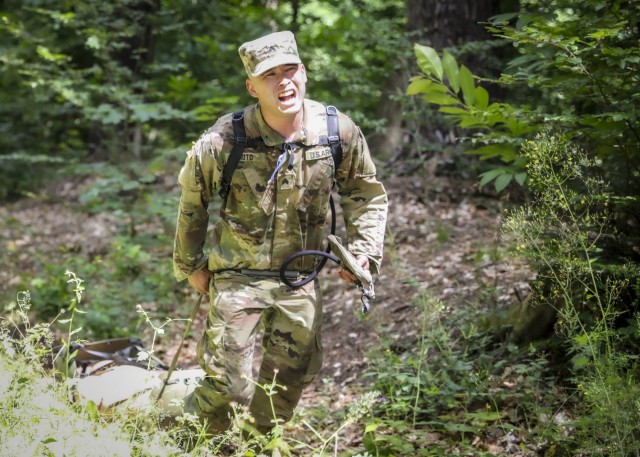 LANDSTUHL, Germany – U.S. Army Sgt. James Moto, laboratory specialist, U.S. Army Health Clinic Baumholder, performs a litter drag with a simulated casualty during Landstuhl Regional Medical Center’s Best Warrior Competition, July 7. The...