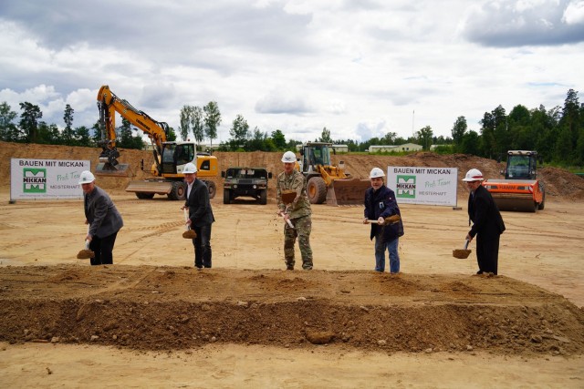 Leaders break ground for a new vehicle maintenance shop at the construction site near Tower Barracks Gate 6, July 15, 2021. From left to right stand 7th Army Training Command Deputy Chief of Staff Dr. Michael Schaefer, Mickan Construction Co. CEO Guenther Hofbeck, U.S. Army Garrison Bavaria Commander Col. Christopher Danbeck, State Construction Office Amberg-Sulzbach Chief Roman Beer, and U.S. Army Corps of Engineers Europe District Regional Program Manager Peter Barth. (Photo by Andreas Kreuzer / USAG Bavaria Public Affairs)