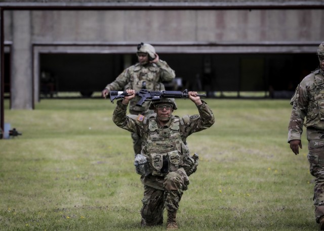 LANDSTUHL, Germany – U.S. Army Spc. Jesse Arellano, patient administration specialist, U.S. Army Health Clinic Baumholder, performs lunges during the stress shoot event of Landstuhl Regional Medical Center’s Best Warrior Competition, July 7....