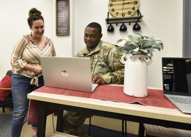 Casey Thompson (left) is a transition specialist with the United Service Organizations’ Transitions Pathfinder Program, who oversees the Fort Leonard Wood Spouses Employment Lounge. She meets with Pfc. James Freeman, from the 515th Engineer...