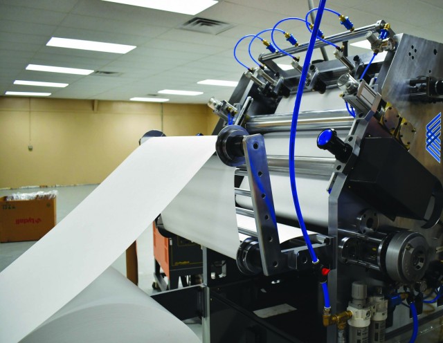 Filter media is fed into the Directorate of Chemical and Biological Defense Operation’s new pleating machine.