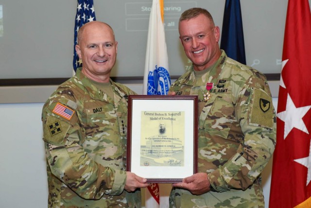 Army Materiel Command’s Maj. Gen. Bob Harter, right, receives the General Brehon Somervell Award of Excellence, presented by AMC Commander Gen. Ed Daly on behalf of the Combined Arms Support Command during a July 20 farewell and awards ceremony at AMC Headquarters, Redstone Arsenal, Ala. The award recognizes Harter’s ability as a multi-functional logistician. Harter is going to be the as Deputy Chief of Army Reserve, Office of the Chief of Army Reserve. (U.S. Army Photo by Doug Brewster)