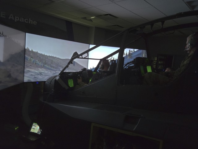 Chief Warrant Officer 5 Daniel Piland (r) and Chief Warrant Officer 2 Stephen Burns, both Apache helicopter pilots with the N.C. ARNG, conduct a simulated mission during CABAIL TIE 21-1.