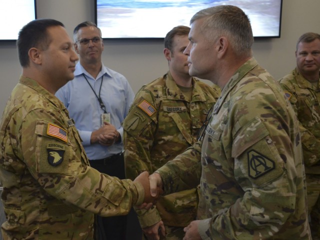 Brig. Gen Robert Barrie thanks Capt. Michael Kromenacher, an AH-64 Apache pilot with the N.C. ARNG. Kromenacher was one of 13 Soldiers from the TN, GA, and NC ARNG who participated in CABAIL TIE 21-1.