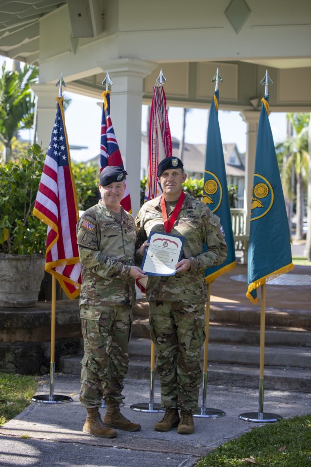 Army Sustainment Command's commanding general, Maj. Gen. Chris Mohan, poses with 402nd Army Field Support Brigade's Command Sgt. Maj. Lepley after presenting him with the Ordinance Order of Samuel Sharpe.