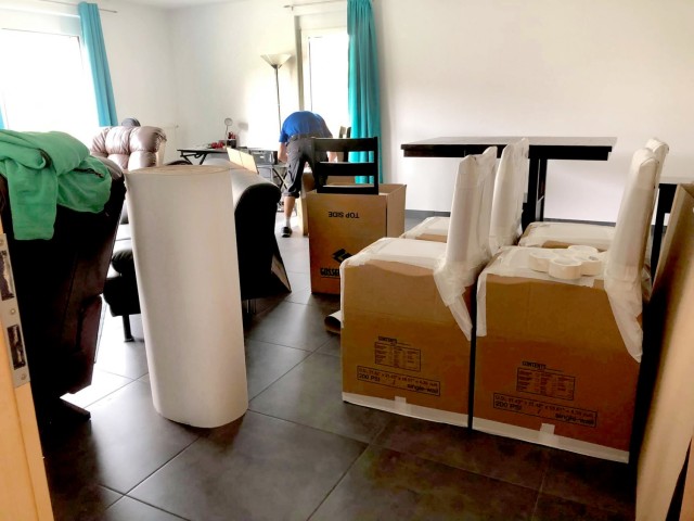 An employee of a German moving company packs up a dining set of an American U.S. Army Garrison Rheinland-Pfalz employee for a PCS move July 12, 2021.