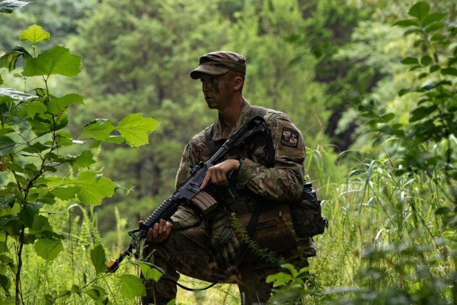 Jake Knight, a Cadet from Illinois State University, stands guard as Cadets from 5th Regiment, Advanced Camp, move to engage their assigned target. Cadets engaged against a fictitious opposing force played by active duty Army Soldiers. | Photo by...