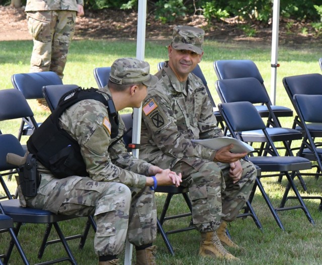 Col. James J. Zacchino Jr. talks with a Soldier from the 91st Military Police Battalion on July 22 during the rehearsal for the Fort Drum garrison change of command ceremony. Zacchino will assume command of the Fort Drum garrison during a ceremony at LeRay Mansion on July 23. (Photo by Mike Strasser, Fort Drum Garrison Public Affairs)