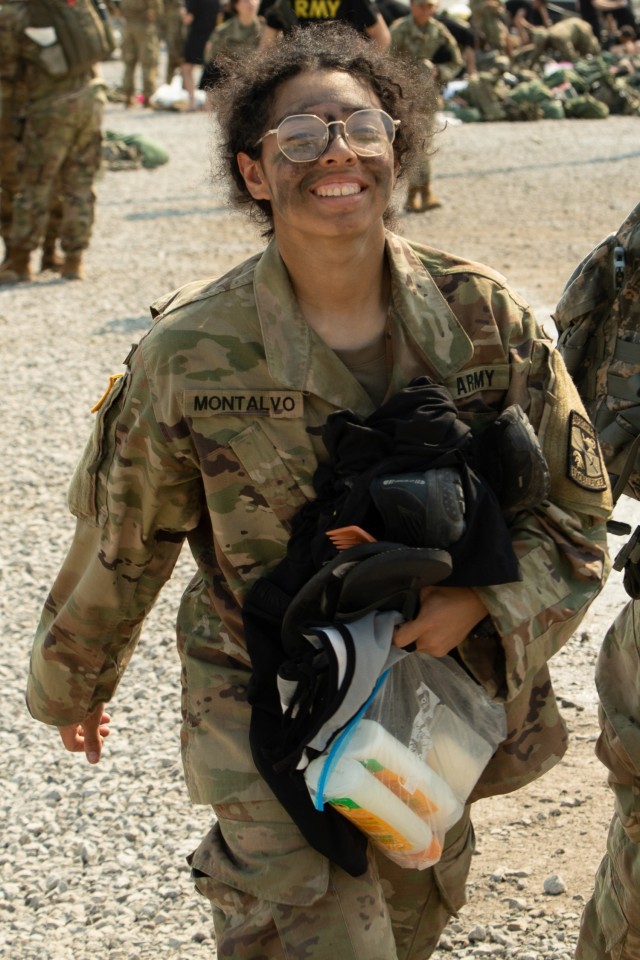 Cadet Daisy Montalvo, Texas A&M University, walks to the shower trailer holding a change of clothes and toiletries during Refit. Cadets receive refit days , which allow them to shower and do their laundry, every three to four days while completing...