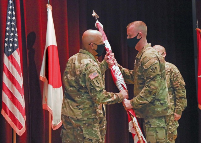 Col. Gary S. Bonham receives the Japan Engineer District Colors from Brig. Gen. Kirk Gibbs, Commanding General, Pacific Ocean Division, and thus assumes command of Japan Engineer District at a Change of Command ceremony July, 20, 2021