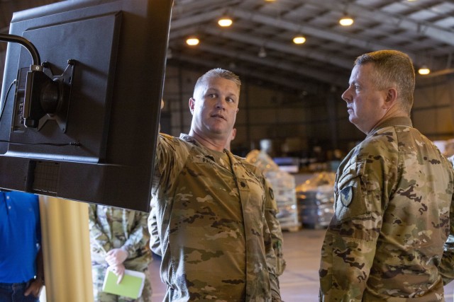 402nd Army Field Support Battalion-Hawaii's commander, Lt. Col. Timothy Page briefs Army Sustainment Command's commanding general, Maj. Gen. Chris Mohan on the battalion's Modernization, Displacement, and Repair Site. Mohan used his time in Hawaii for the 402nd AFSB's change of command ceremony to tour ASC's Pacific footprint.