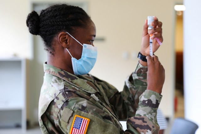 Pfc. Shaniah Edwards, Medical Detachment, prepares to administer the Moderna COVID-19 vaccine to soldiers and airmen at the Joint Force Headquarters, February 12, 2021.



The Virgin Islands National Guard remains ready, relevant, and responsive in our efforts to support our community during the pandemic.

(US Army National Guard photo by Sgt. Leona C. Hendrickson)