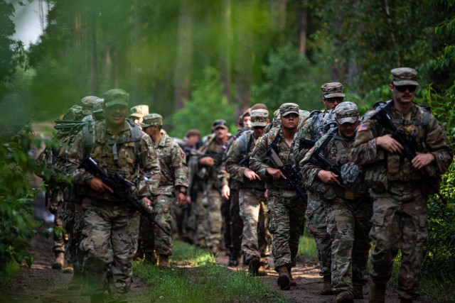 U.S. Army Soldiers from 3rd Battalion, 161st Infantry Regiment, conduct a ruck march at Bemowo Piskie Training Area, Poland, July 16, 2021. This was a part of the Team Leader Academy, an event held in order to sustain leadership qualities between...
