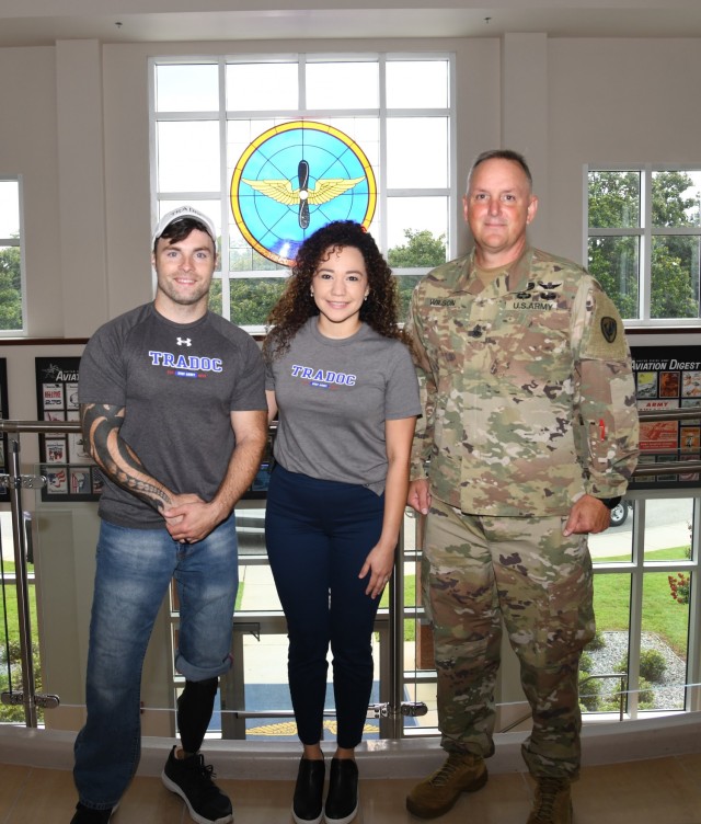 U.S. Army veteran and motivational speaker J.P. Lane, along with his wife Crystal, stand for a photo with U.S. Army Command Sgt. Maj. James Wilson, aviation branch command sergeant major, during a visit to the U.S. Army Aviation Center of Excellence headquarters at Fort Rucker, Alabama, July 19, 2021. (U.S. Army photo by Kelly Morris)