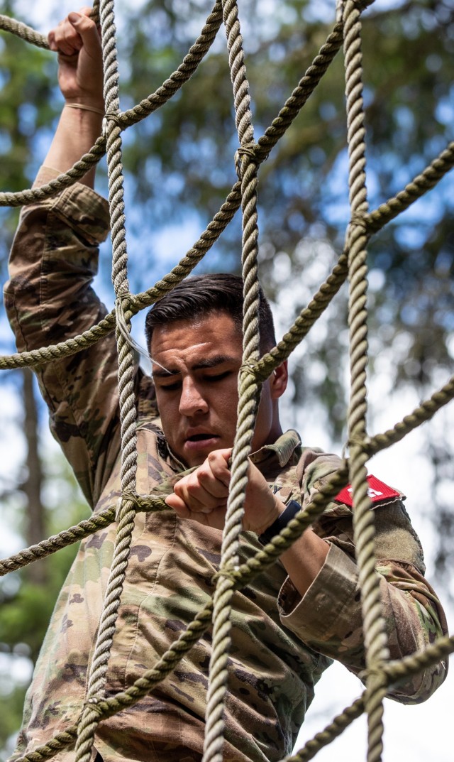 Spc. Jarrett Rodriguez from Desmond Doss Health Clinic ensures his grip as he climbs down the netting during the obstacle course at Regional Health Command-Pacific’s Best Leader Competition Tuesday, June 15, 2021, Joint Base Lewis-McChord, Wash. Rodriguez is a member of the RHC-P team competing in the U.S. Army Medical Command Best Leader Competition, July 25-30.
 