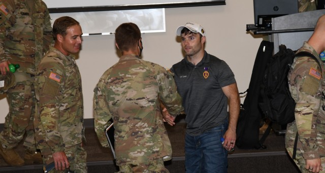 Decorated U.S. Army veteran and motivational speaker J.P. Lane talks with Soldiers after a session focused on resiliency at Fort Rucker July 20, 2021. (U.S. Army photo by Kelly Morris)