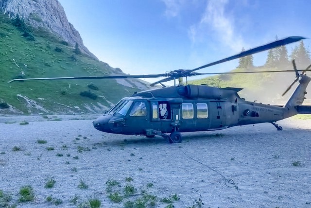 A UH-60 Black Hawk helicopter belonging to 16th Combat Aviation Brigade briefly idles outside Mount Saint Helens, Wash. on Jul. 21, 2021.  The aircraft dropped off a Special Forces team to assist in the search for 1st Lt. Brian Yang.