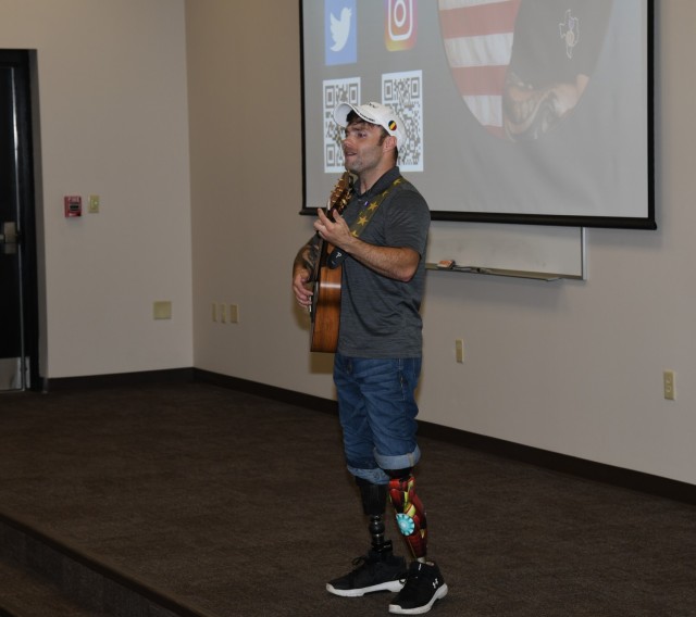 Decorated U.S. Army veteran and motivational speaker J.P. Lane performs a song as part of a presentation to students from the Aviation Captains Career Course, Basic Officer Leaders Course, and Warrant Officer Basic Course at Fort Rucker July 20,...